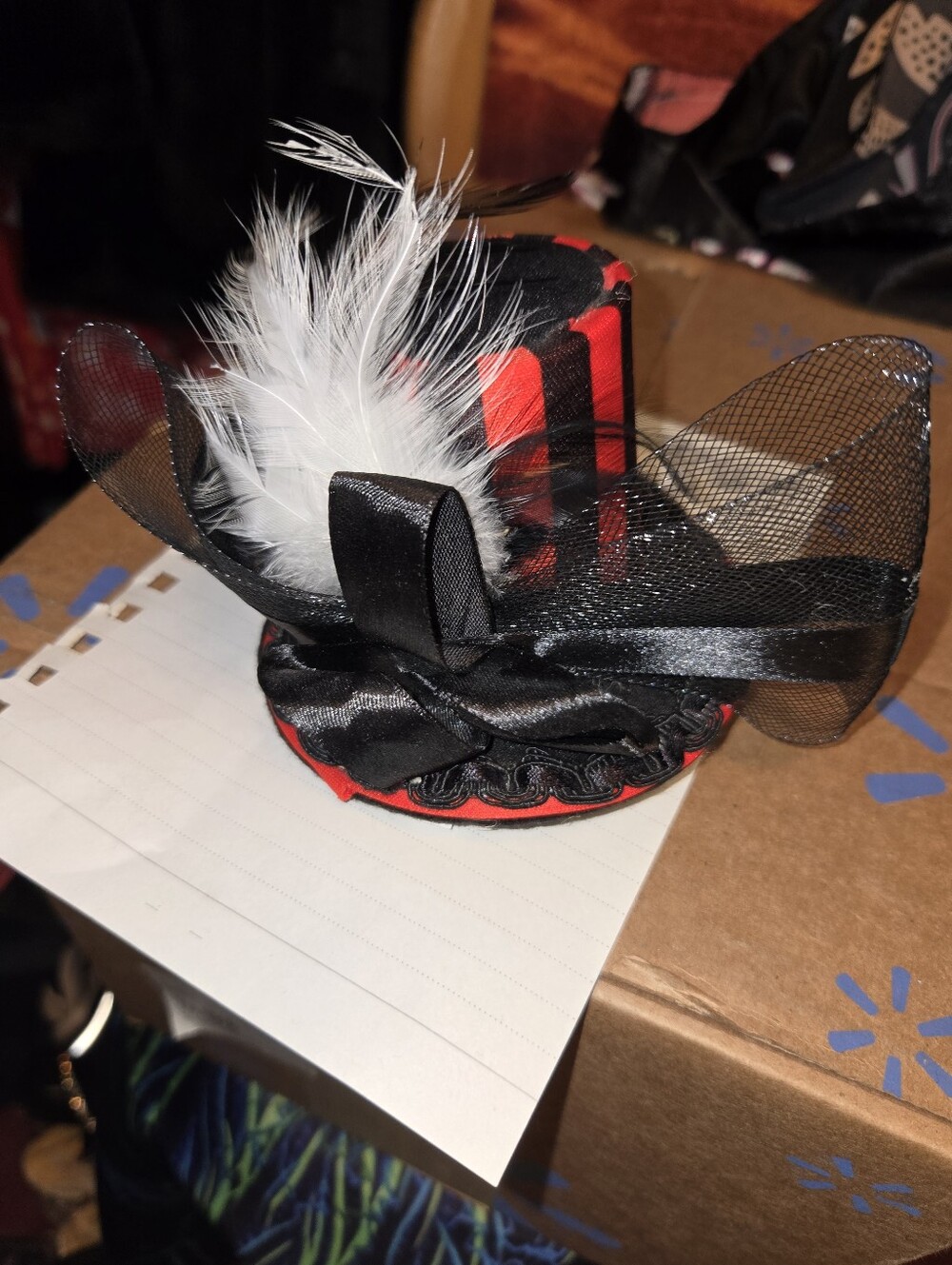 Red and Black Mini Top Hat with White Feather